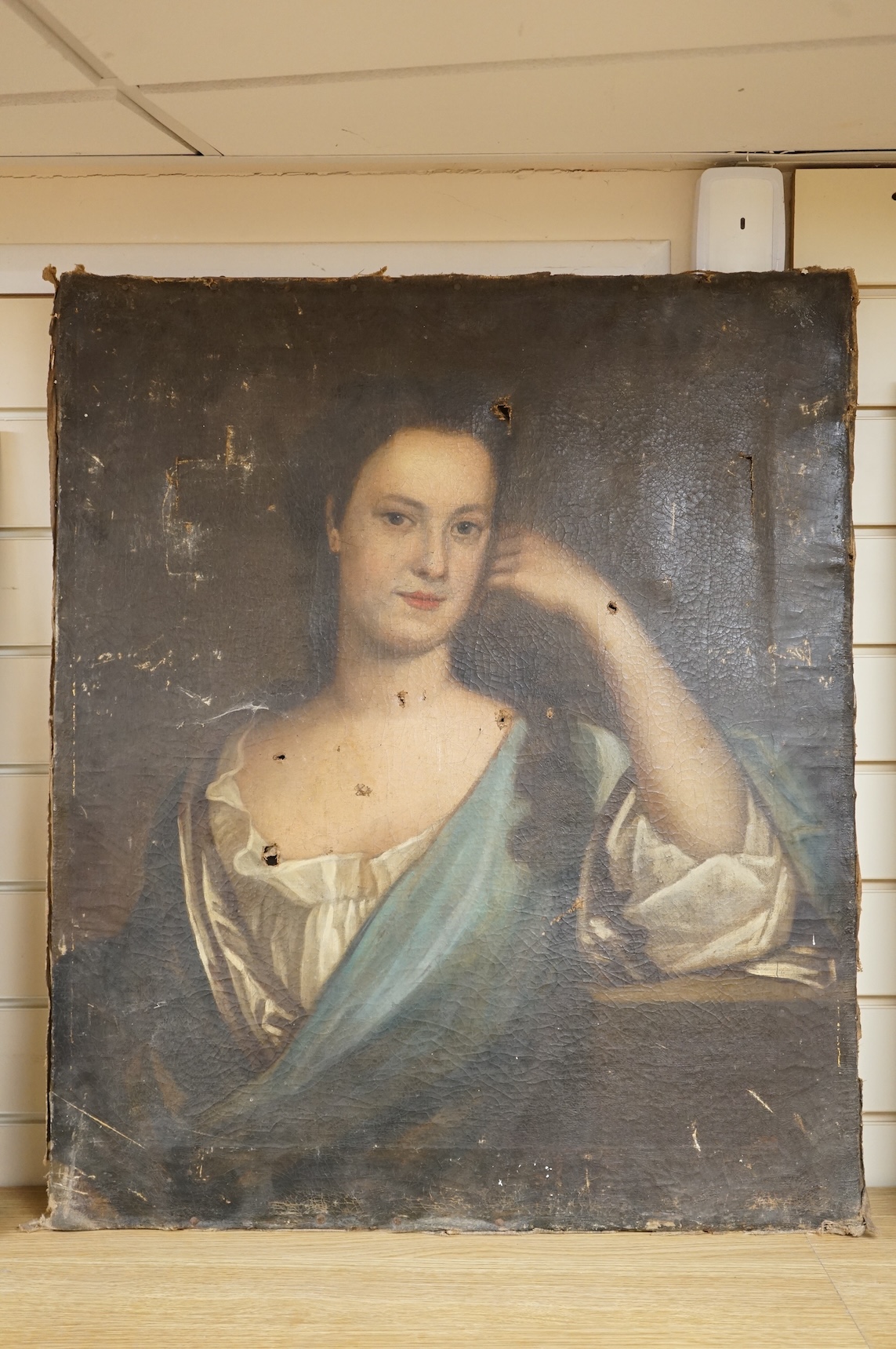 Manner of Michael Dahl (Swedish, 1659-1743), oil on canvas, portrait of a lady, unframed, holes to canvas, a.f, 76 x 65cm